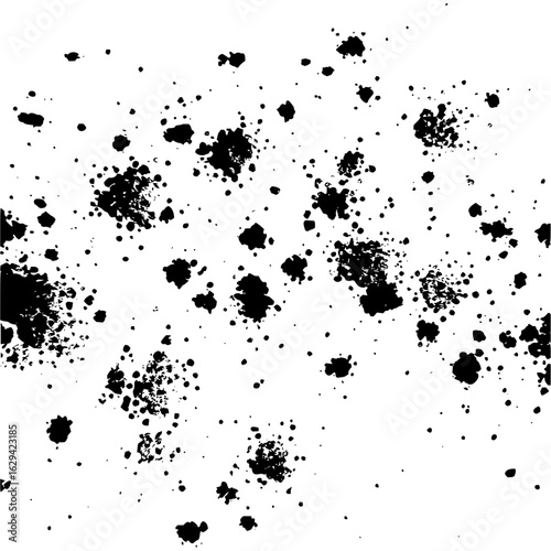 Scattered black ink blotches and splatters on a white background creating an abstract messy composition