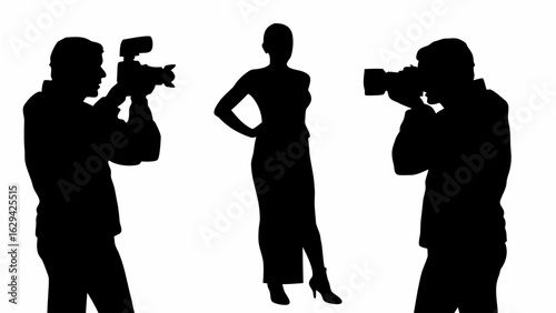 Silhouette of a model posing while two photographers are taking pictures of her in a studio setting