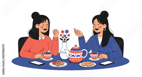 Two young women enjoying afternoon tea with biscuits and conversation around a table