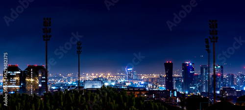 Photography Nighttime City Skyline with Illuminated Buildings in Barcelona, Spain