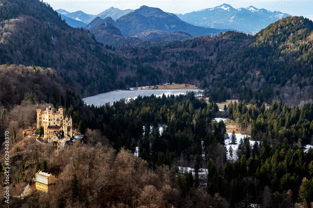 Fototapeta premium Aerial View of a Castle in a Mountainous Landscape in Bayern, Germany