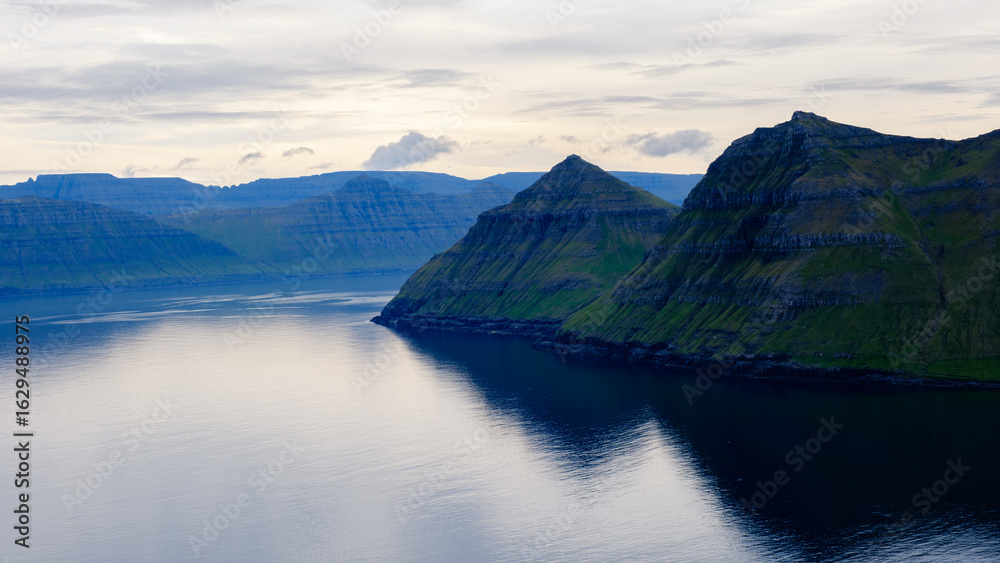 Naklejka premium Explore the breathtaking Gonguturur Hvithamar Trail in the Faroe Islands with stunning coastal views