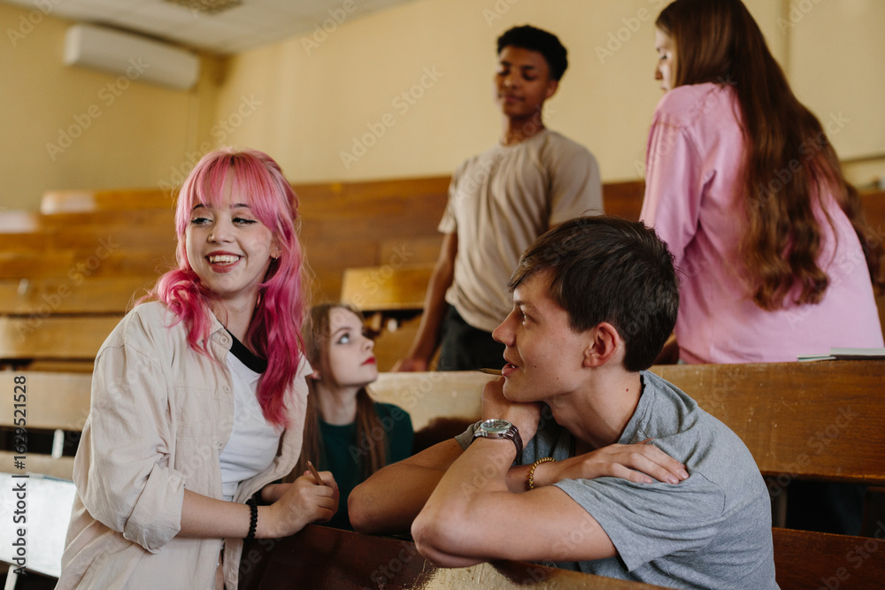 Fototapeta premium Group of Diverse Students Socializing in a Classroom Setting