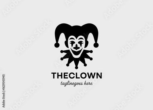 This logo portrays a whimsical clown face with playful elements, embodying joy, entertainment, and fun in a friendly and charismatic design.