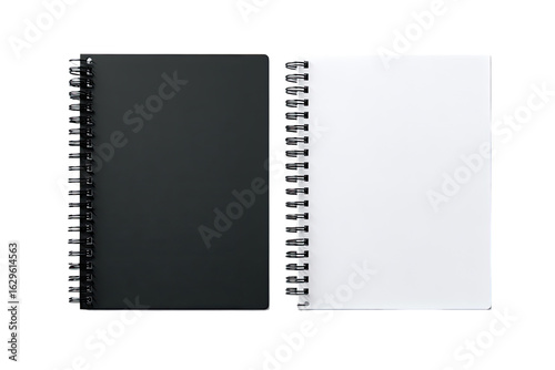 Two spiral-bound notebooks, one black, one white, lie open.  Blank pages are visible.  Both feature a similar, simple design
