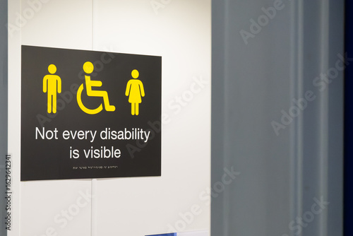 Not every disability is visible sign. Public campaign sign about invisible disabilities (like Ulcerative Colitis and Crohn's Disease).