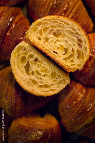 Close-up layered texture of appetizing freshly baked croissants.