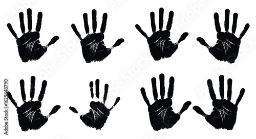 Collection of eight black handprints and fingerprints on a white background representing individuality and human connection