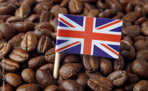 The Union Jack flag or UK flag on roasted coffee beans. Concept for export, import, business, market, industry and tariff of coffee bean. Generated image