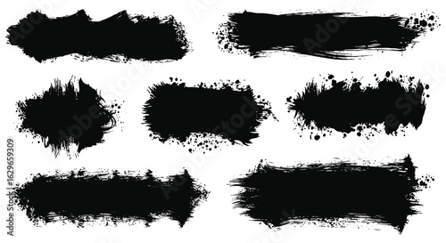 Collection of seven rough black paint brush stroke textures and splatters on a white background