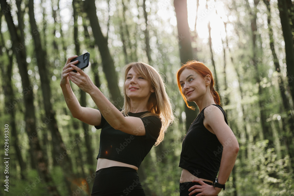 © dsheremeta - Women enjoying outdoor exercise in forest