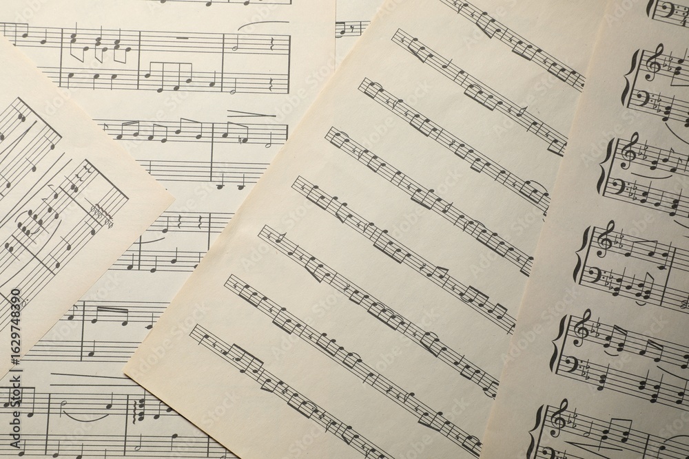 Obraz premium Sheets with musical notes as background, top view