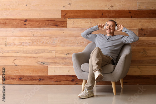 Old man sitting in armchair...