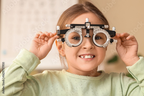 Cute little girl with optic...