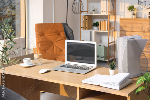 Workplace with blank laptop...