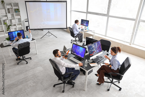 Team of traders working at ...