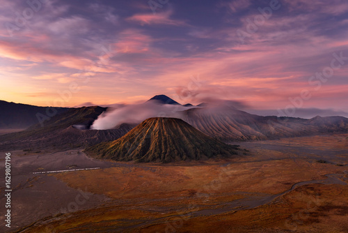  Beautiful sunrise at Tengger volcanic chain with smoking Bromo mount and the colorful Batok mount, Bromo - Tengger Semeru National Park, East Java, Indonesia
