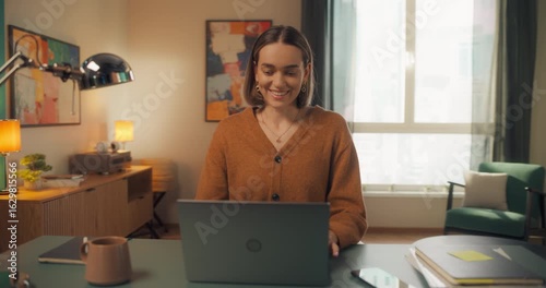 Wallpaper Mural Young Caucasian Female Opening Up a Laptop and Starting to Work at Home. Woman Sitting Behind a Table in Living Room, Using Computer. Dynamic Close Up Portrait Made with a Robotic Camera Arm Torontodigital.ca
