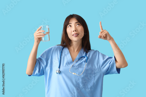 Female Asian doctor with gl...