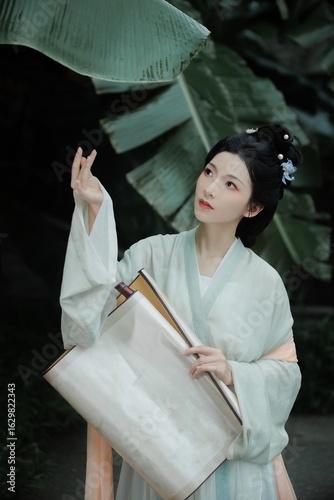 Young woman in traditional attire surrounded by greenery Chinese word means leaves.