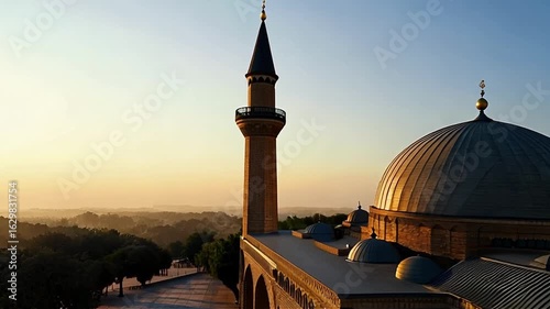 Sunset View of a Mosque with Dome and Minaret During Golden Hour