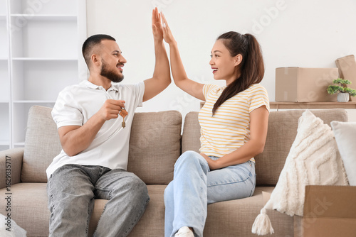Young couple with key from ...
