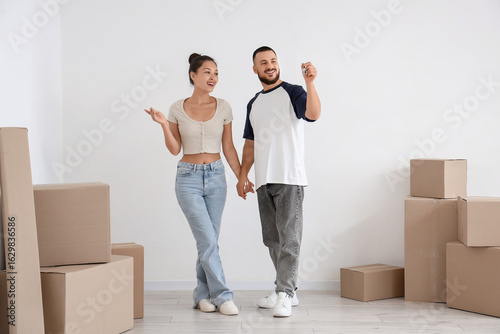Happy young couple holding ...