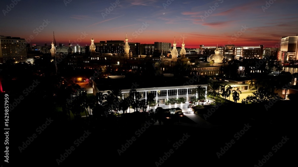 Fototapeta premium Sunset University Of Tampa In Tampa Florida United States. Modern City Center With Skyscrapers Reflecting The Urban Life. Building Town Sky Clouds Illumination Urban. Town Illumination.