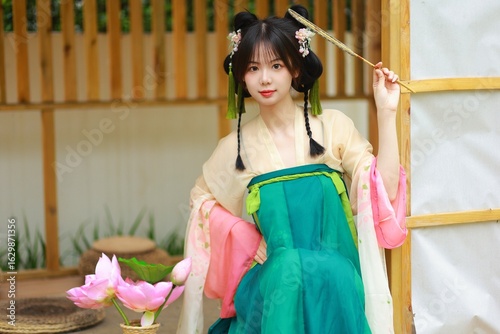 Canvastavla Young Asian woman in traditional attire with lotus flowers Chinese word means lotus