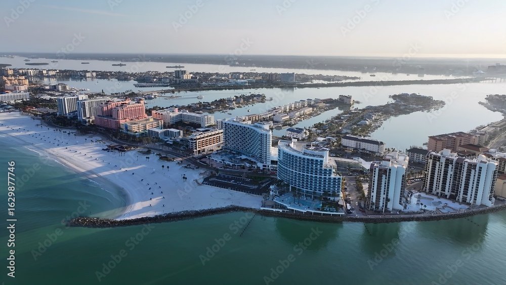 Fototapeta premium Clearwater Beach In Clearwater Florida United States. Aerial View Of A Bustling City With High-Rise Buildings And Traffic. Sunset Coast Sky City Seaside. Coast City. Clearwater Florida.