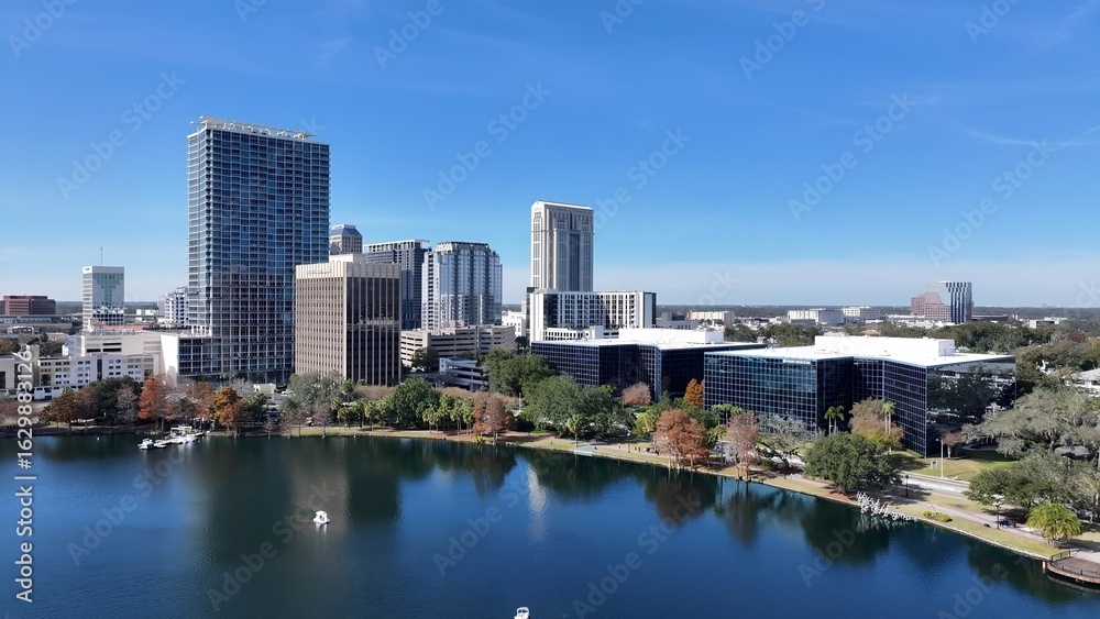 Fototapeta premium Eola Park In Orlando Florida United States. Aerial View Of A Bustling Downtown Cityscape With Modern Buildings. Town Sky Backgrounds Urban. Outside Backgrounds Up Above. Orlando Florida.