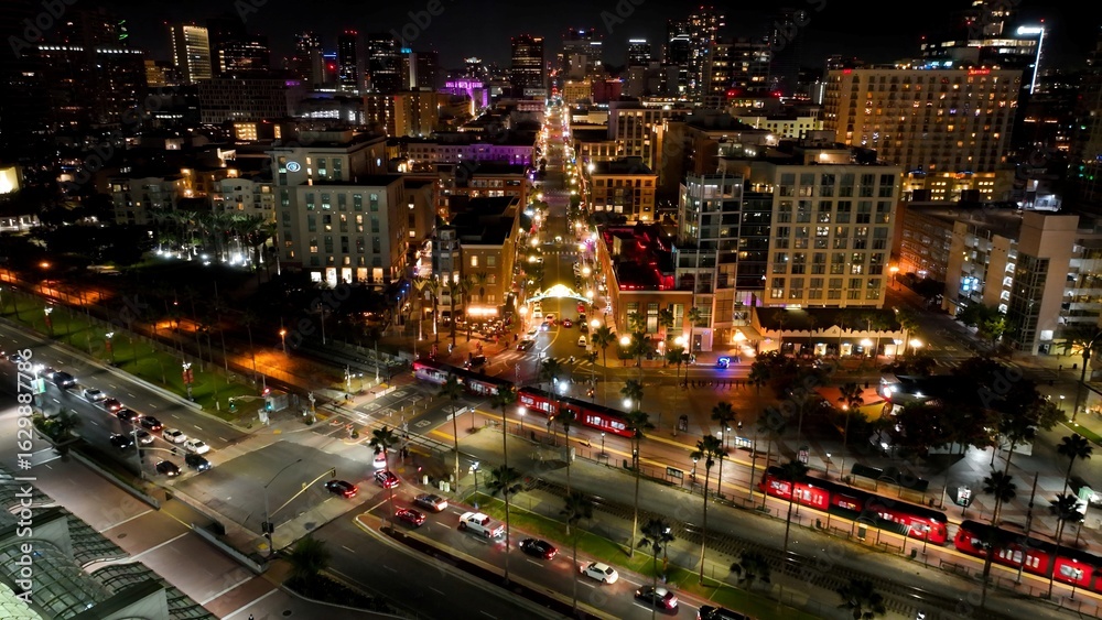 Fototapeta premium Night Gaslamp Quarter In San Diego California United States. Modern City Center With Skyscrapers Reflecting The Urban Life. Building Sky Background Illuminated Urban.