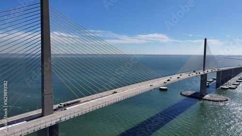 Sunshine Skyway Bridge In Saint Petersburg Florida United States. Breathtaking Aerial View Of Busy Traffic In A Freeway Road. Coast Horizon Seaside Summertime. Coast Panoramic.