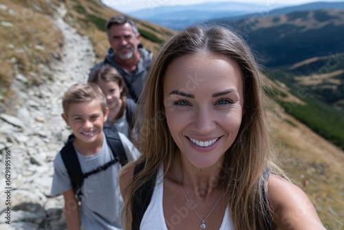 Mountain trail selfie, Smiling mom with family, Joyful hiking moment