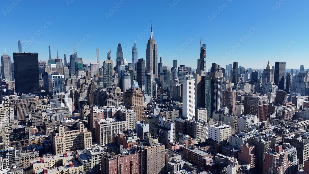 Obraz premium New York Skyline In Manhattan New York United States. Aerial View Of A High-Rise Buildings And Traffic Showcasing Urban Life. Business Sky Downtown Cityscape. Business Panning Wide.
