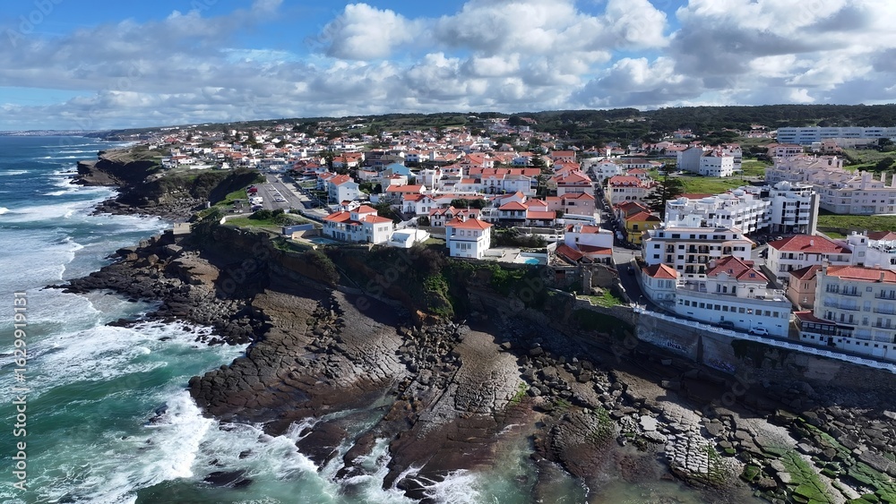 Fototapeta premium Coast Village In Sintra Lisbon District Portugal. Birds Eye View Of Stunning Cityscape With Streets And Buildings. Coast Clouds Seaside Summertime. Outdoors Seaside Scenic Coastline.
