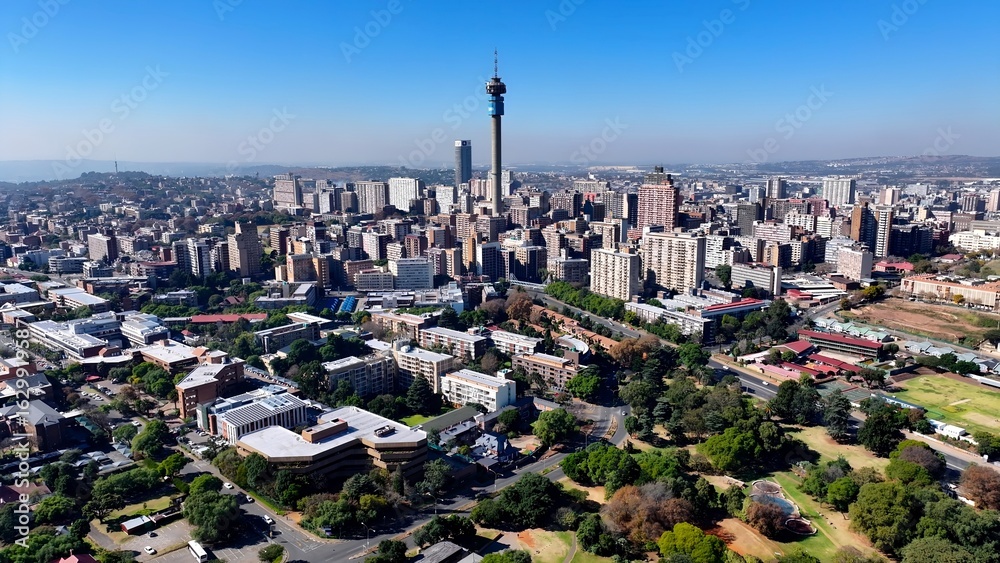 Obraz premium Johannesburg Skyline In Johannesburg Gauteng South Africa. Aerial View Of A High-Rise Buildings And Traffic Showcasing Urban Life. Business Clouds Sky Downtown Cityscape.