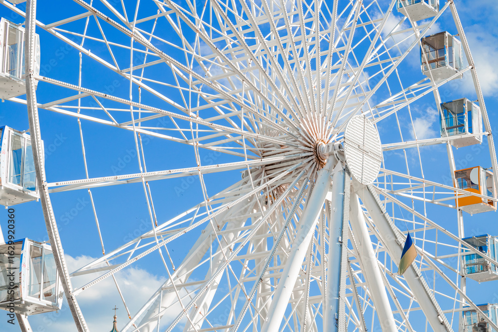 Obraz premium Ferris Wheel metallic circle frame amusement park object in the city vivid colorful environment space