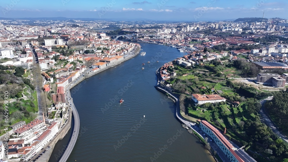Fototapeta premium Porto Skyline In Porto Portugal. Aerial View Of A Bustling Downtown Cityscape With Modern Buildings. Town Sky Clouds Backgrounds Urban. Town Panorama. Porto Portugal.