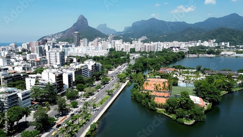 Rodrigo De Freitas Lake In Downtown City Rio De Janeiro Brazil. Aerial View Of A River Surrounded By Lush Green Tropical Rainforest. Town Sky Clouds Backgrounds Urban. Town Panorama.