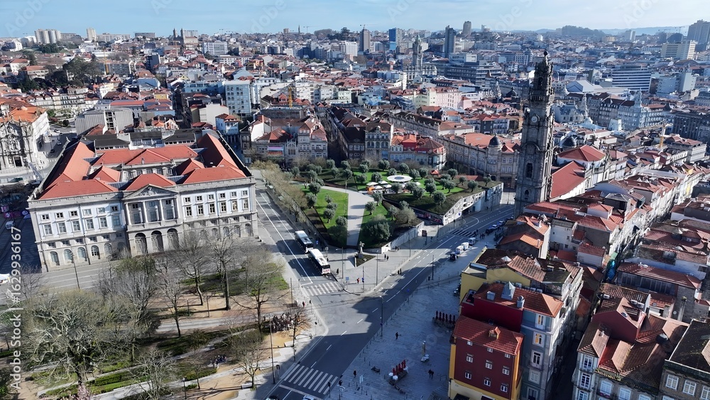 Fototapeta premium Clerigos Church In Porto Portugal. Bird Eye View Of Church Standing Tall Amidst Beautiful Scenery. Business Sky Clouds Downtown Cityscape. Outdoor Downtown Panning Wide. Porto Portugal.