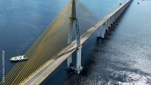Suspension Cable Bridge In Manaus Amazonas Brazil. Bridge Showcasing The Traffic Flowing Across In The City. Business Sky Downtown Cityscape. Business Panning Wide. Manaus Amazonas.
