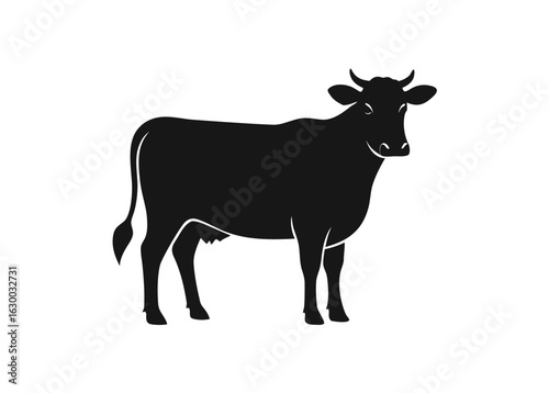 Black silhouette of a standing cow on a white background