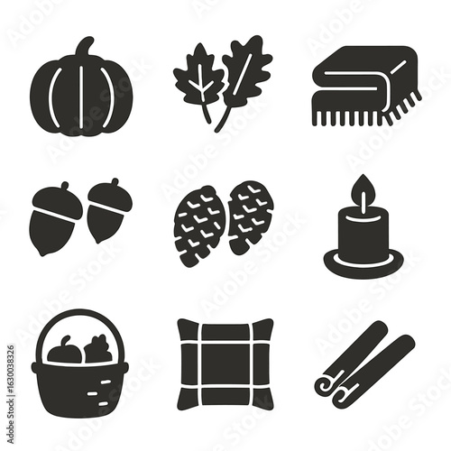Fall Décor Icons. Solid, filled icons set of fall home décor: pumpkin, autumn leaves, cozy blanket, acorns,