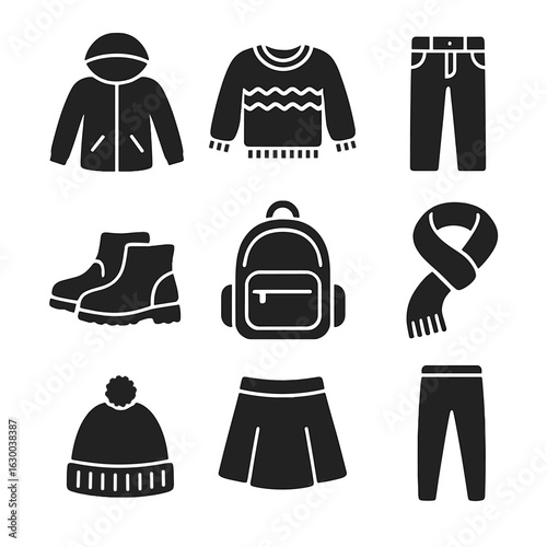 Fall Fashion Icons. Solid, filled icons set of fall fashion for school kids: windbreaker, knit sweater,