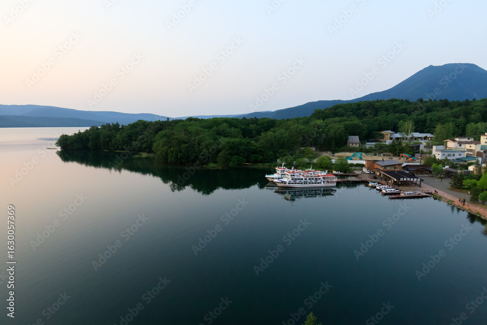 Fototapeta premium Tranquil Lakeside View of Lake Akan with Mount Oakan in Hokkaido, Japan