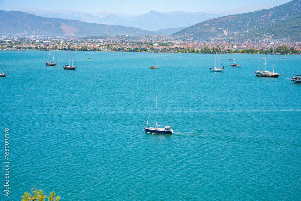 Fototapeta premium Blue Lagoon and Oludeniz beach aerial panoramic view. Oludeniz is a beach resort in the Fethiye district of Mugla Province, Turkey.