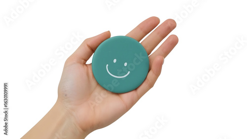 Simple joy captured as a smiling face token rests gently in an open palm