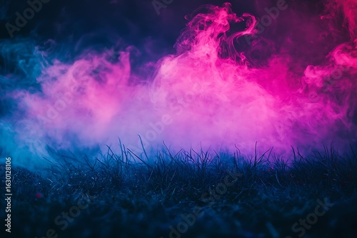 Vibrant pink and blue smoke billows dramatically across a dark textured background creating an abstract and energetic atmospheric effect