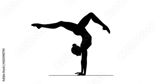 Silhouette of a flexible woman balancing in an advanced handstand yoga or gymnastics pose.